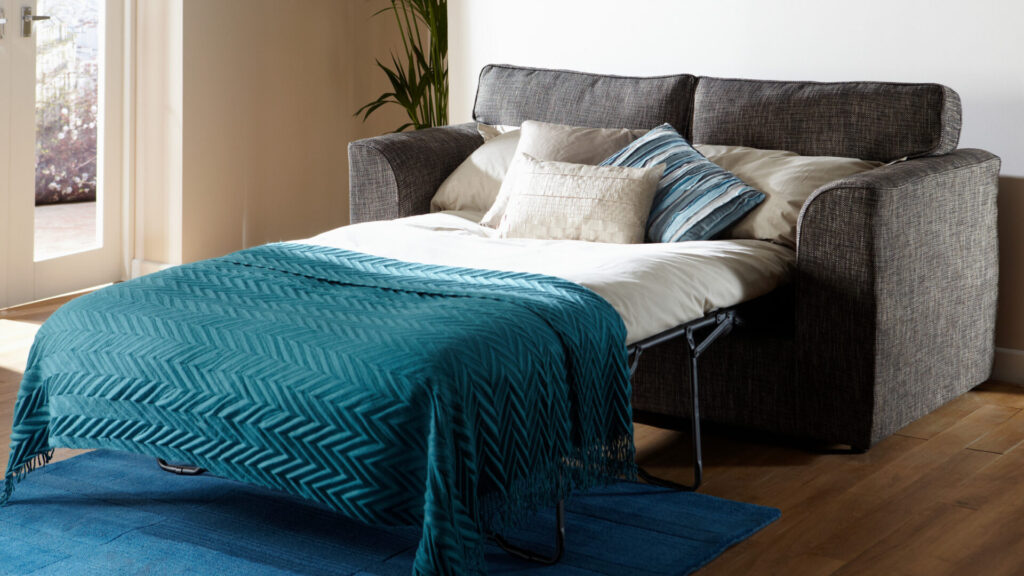 Make use of multifunctional furniture such as sofa-cum-beds. Source: Canva